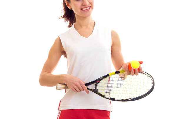 Woman with tennis racquet and ball - Фото, изображение