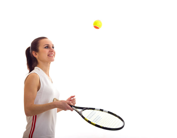 Woman playing with tennis racquet - Zdjęcie, obraz