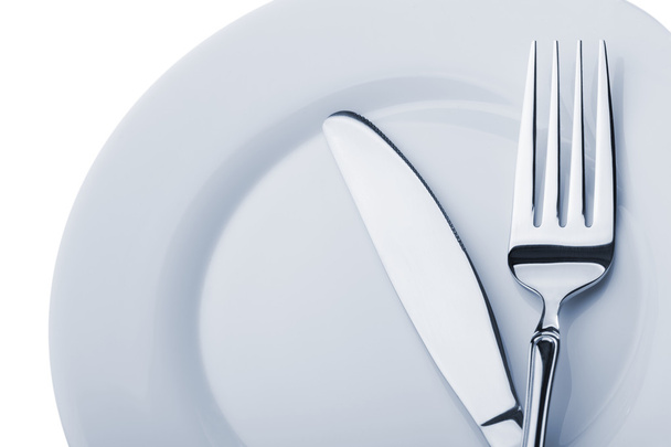 Knife and fork on a plate - Photo, Image
