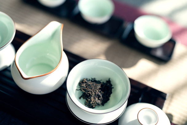 Asian tea set on wooden table - Foto, imagen