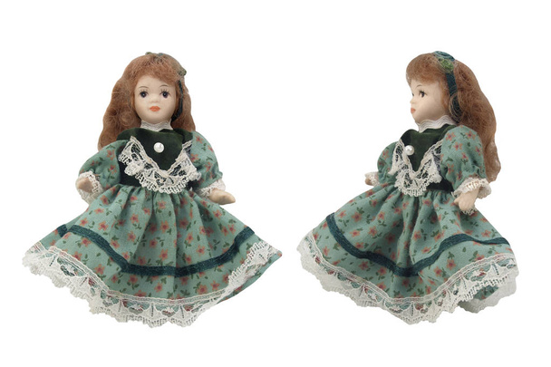 Porcelain doll in green dress. - Photo, Image
