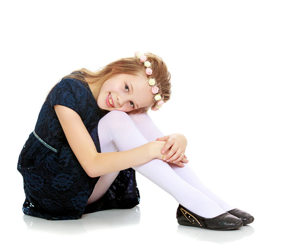 Beautiful little girl posing sitting on the floor. - Φωτογραφία, εικόνα
