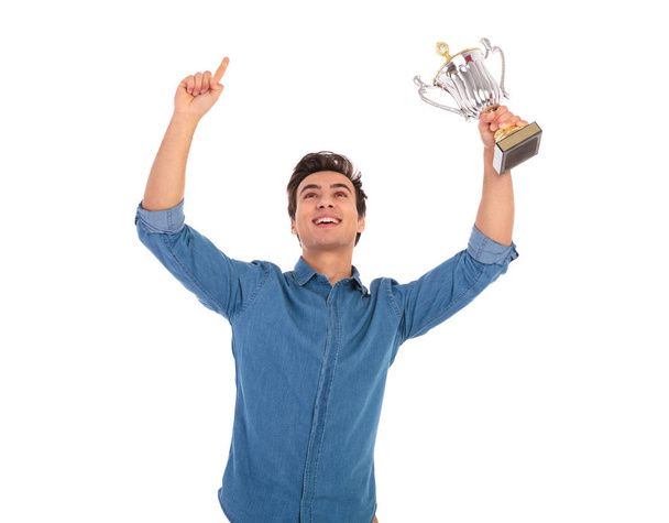 asual man with hands in the air celebrating success  - Foto, Imagem