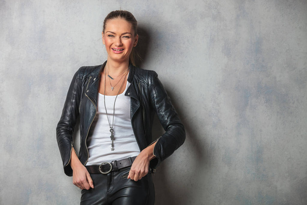laughing young woman in leather jacket posing  - Photo, Image