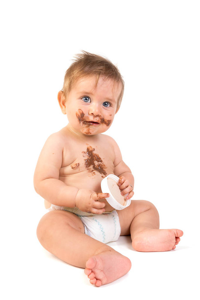 Bebê com chocolate
 - Foto, Imagem