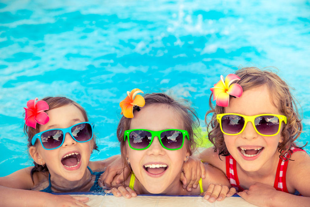 Happy children in the swimming pool - Фото, изображение