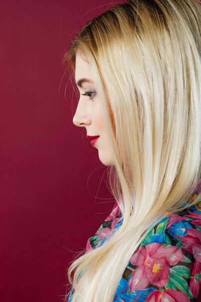 Closeup Portrait of Cute Blonde with Professional Makeup in Studio on Pink Background. - Photo, image