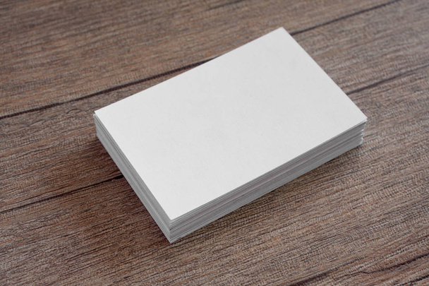 Blank business cards on a wooden background. - Foto, Imagen