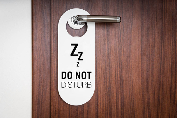 Door of hotel room with sign do not disturb - Photo, Image