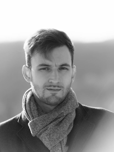 handsome young man in scarf, unshaven guy with stylish hair - Fotó, kép
