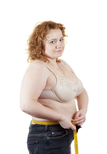 woman measuring waist with tape measure - Фото, зображення