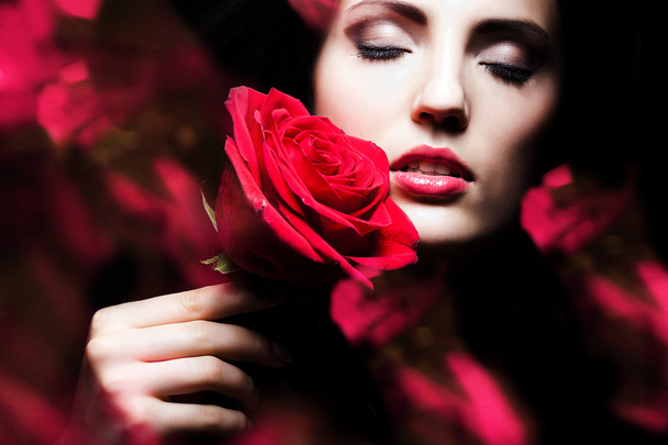 attractive woman with rose in hand - Fotoğraf, Görsel
