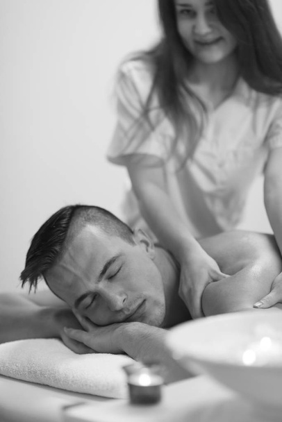 young man having a back massage - Fotó, kép
