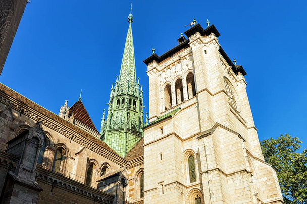 Steeple of St Pierre Cathedral in old town in Geneva - Photo, Image