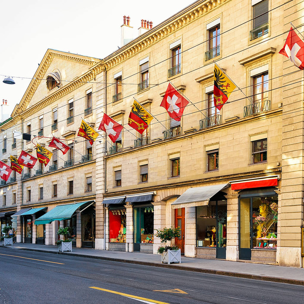 Rue Corraterie Street with Swiss flags in Geneva - Photo, Image