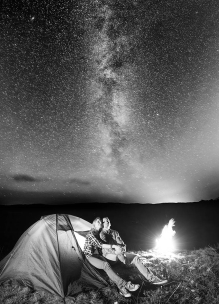 Young pair hikers looking to the shines starry sky  - Photo, Image