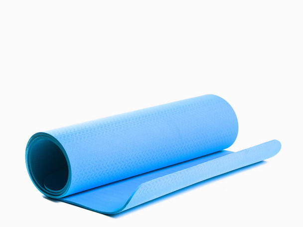 Blue sport mat on isolated background - Photo, Image