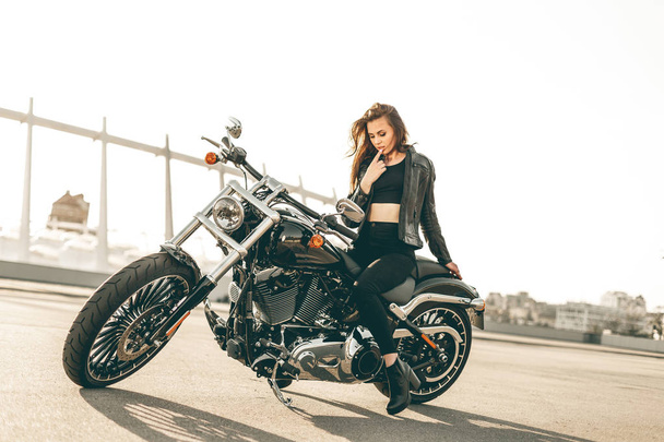 Girl on a motorcycle - 写真・画像
