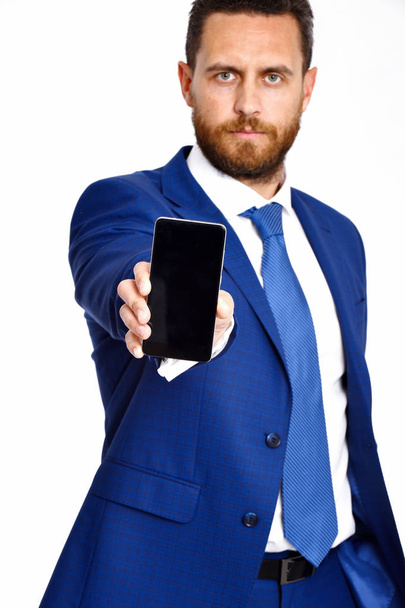 man with phone, businessman in formal outfit with serious face - Фото, изображение