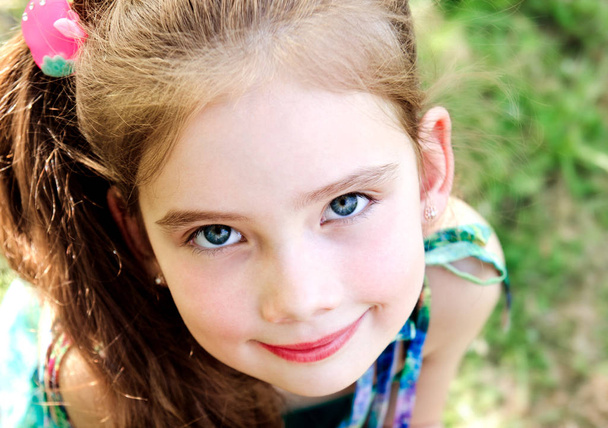 Portrait of adorable smiling little girl outdoor - Foto, Imagem