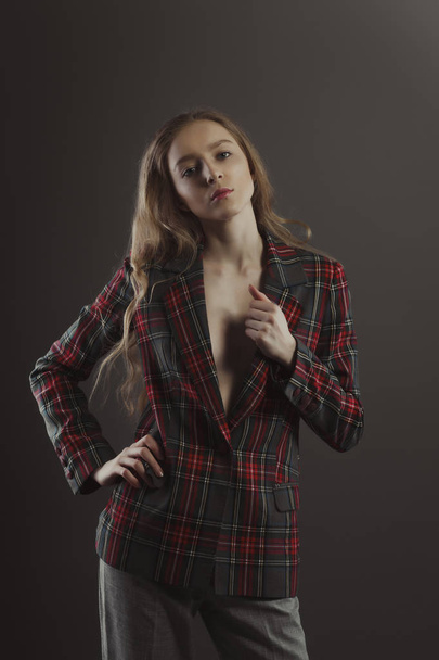 Glorious blonde woman posing for model tests  in checkered jacke - Photo, Image