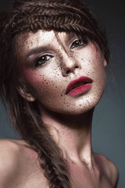 Beautiful strange girl with creative art make-up. Beauty face. - Fotó, kép