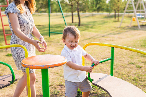 happy child playing at a playground. - Φωτογραφία, εικόνα