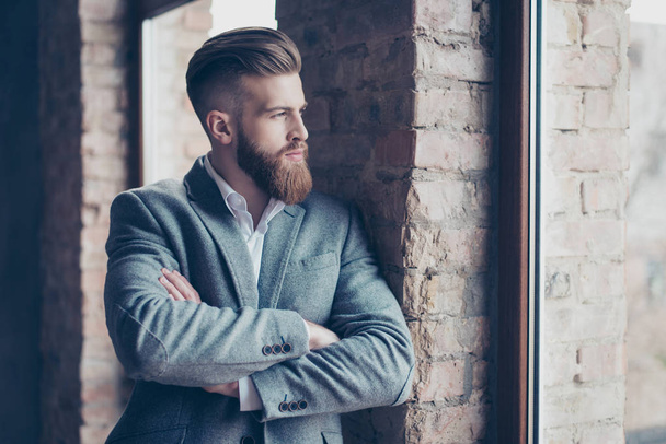 Close up portrait of handsome bearded young man in suit leaning  - Foto, Imagem