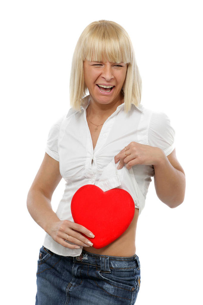 Young woman holding a heart  - Zdjęcie, obraz