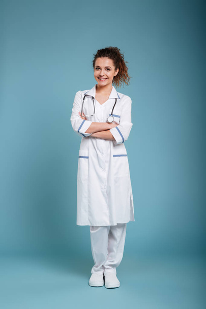 Happy young nurse with stethoscope - Фото, изображение