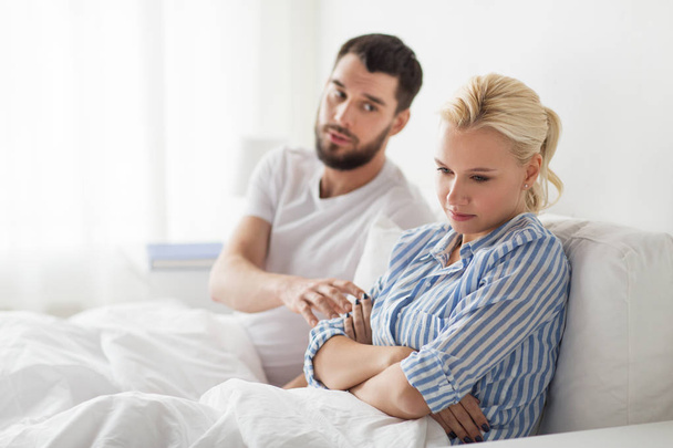 unhappy couple having conflict in bed at home - Photo, image