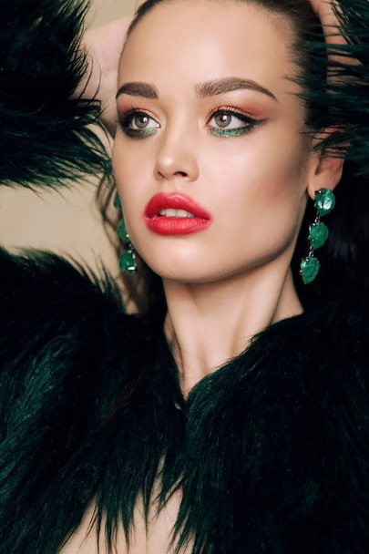 gorgeous woman with dark hair in luxurious fur coat - Фото, изображение