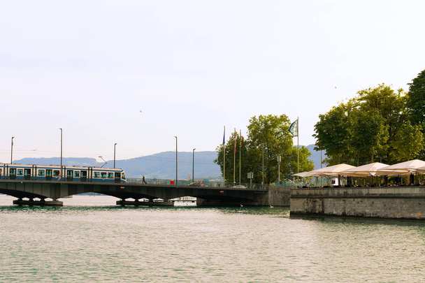 Limmat River and Quai Brucke bridge in Zurich - Photo, Image