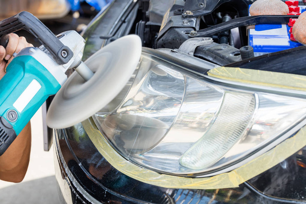 Close up car lamp or front headlight polishing, renewed headlamp - Photo, Image