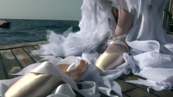 Model in costume of angel clothes pointe shoes on ship near water in Red Sea. - Filmagem, Vídeo