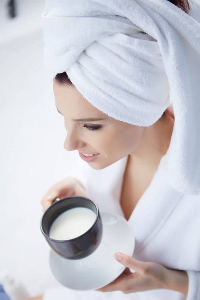 Young woman having a morning milk - Фото, изображение