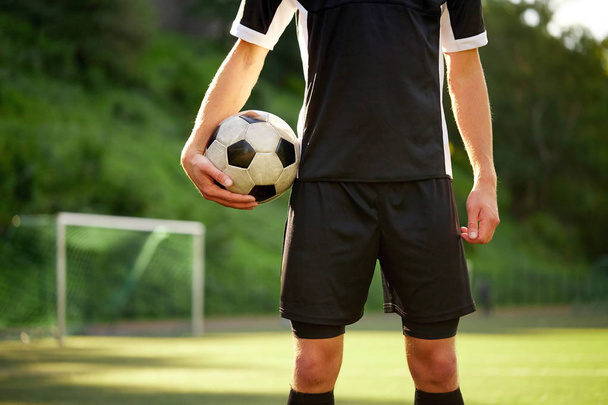 soccer player with ball on football field - Foto, imagen