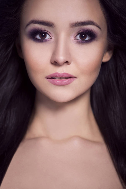 Portrait of a beautiful woman in an evening makeup. - 写真・画像