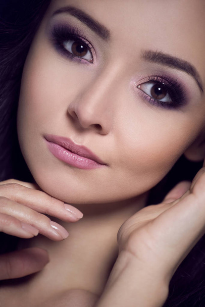 Portrait of a beautiful woman in an evening makeup. - Photo, Image