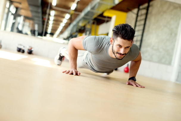 handsome young man doing push ups - Photo, Image