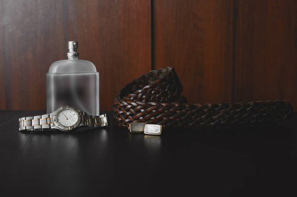 Male accessories . Perfume with belt and cuff - Photo, Image