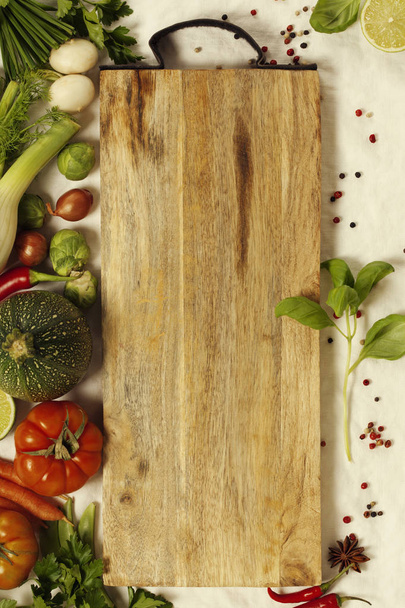 Vegetables, herbs, spices and empty cutting board - Φωτογραφία, εικόνα