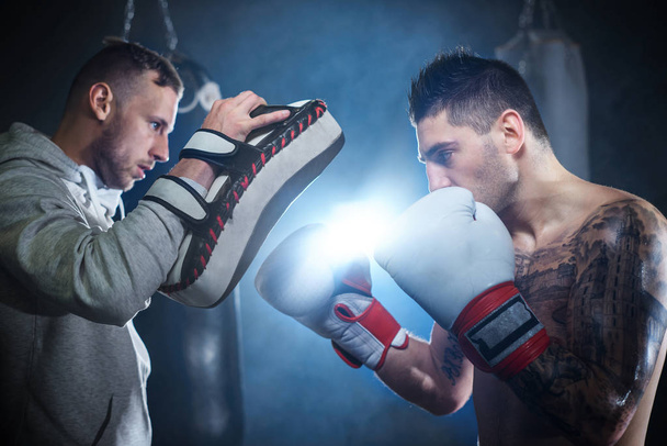 male boxer training with his coach - Foto, Imagem