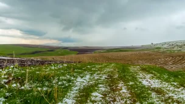 4K, TimeLaps. Snow fell on the spring agricultural fields, in the Aqsa Dzhabaglinsky Reserve, the Western Tian Shat. - Footage, Video