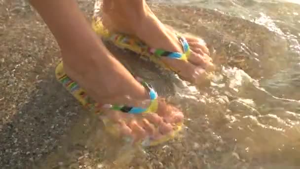 Female feet wearing flip flops. - Footage, Video
