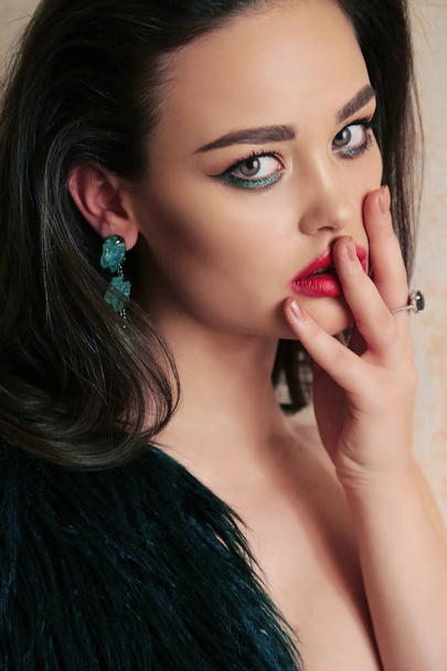 gorgeous woman with dark hair in luxurious fur coat - Fotografie, Obrázek