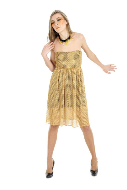 young blonde woman wear golden dress - Photo, Image