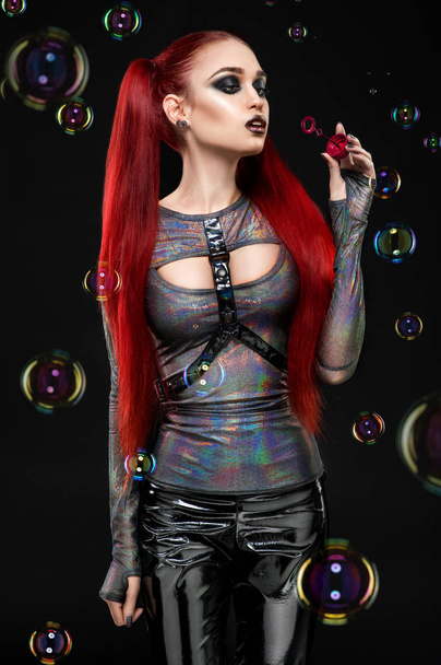 Redhair model blowing air bubbles - Valokuva, kuva