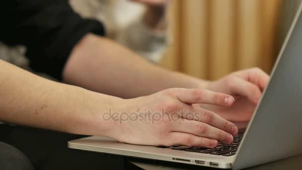Hands touch typing on a laptop keyboard - Video, Çekim