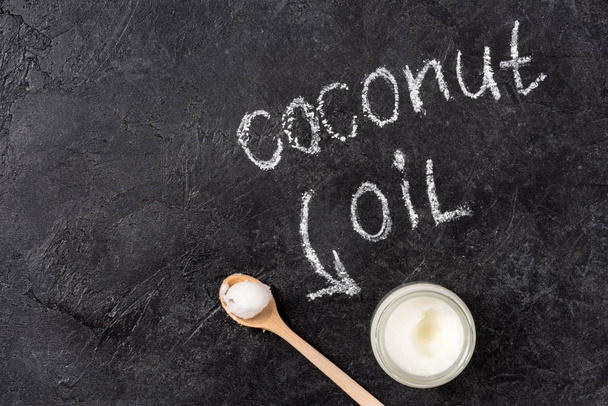 Coconut oil and spoon  - Foto, Imagem